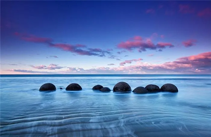 Cảnh mặt trời lặn ấn tượng tại Moeraki Boulders, New Zealand