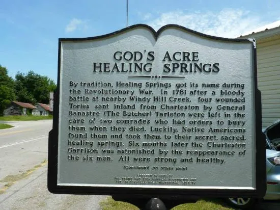 Bia giới thiệu lịch sử hình thành tại lối vào God's Acre Healing Springs.