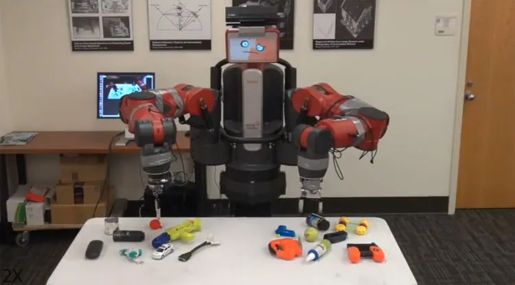 Robot đang học cầm nắm đồ vật.